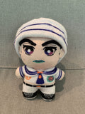 Plush toy in a sailor outfit on a grey background